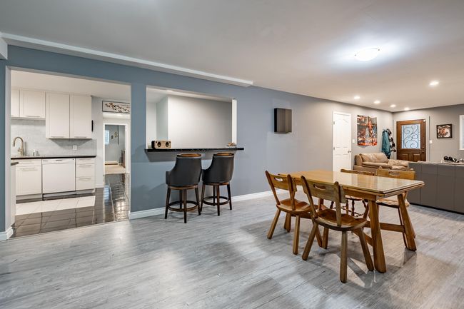 Dining room with recessed lighting and light wood-style floors | Image 23