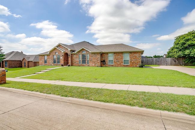 View of front of house with a front yard. | Image 6