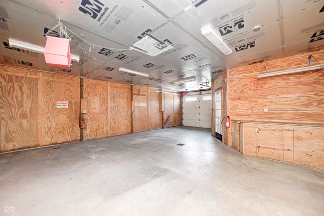 garage with wooden walls | Image 4