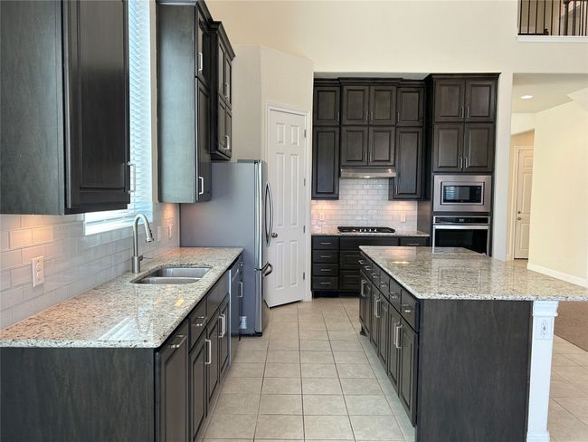 enjoy cooking and entertaining in this chef's delight kitchen | Image 4