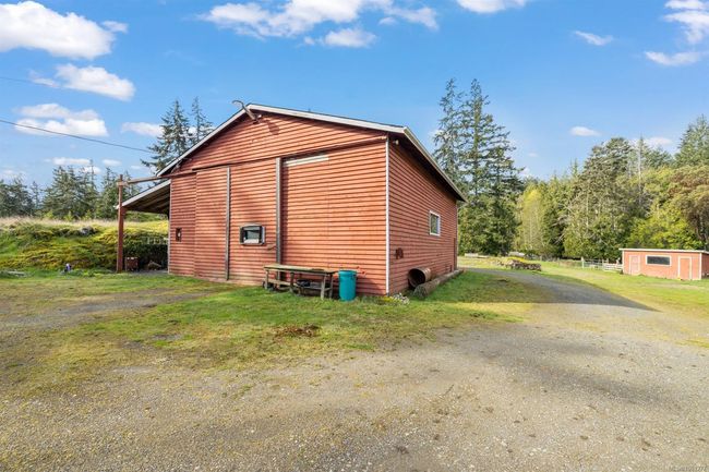 View of side of property with an outbuilding and driveway | Image 33