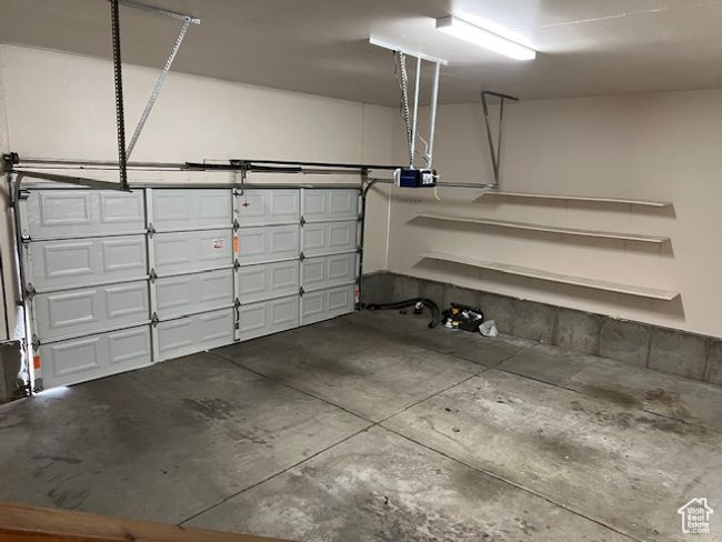 Garage featuring a garage door opener | Image 20