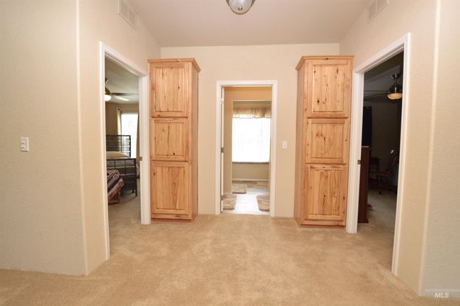 Hall with light colored carpet and healthy amount of natural light | Image 18