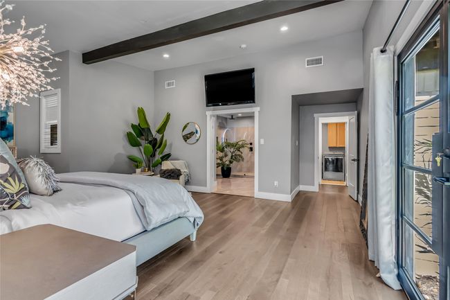 Bedroom featuring recessed lighting, access to outside, wood finished floors, and an accent wall | Image 19
