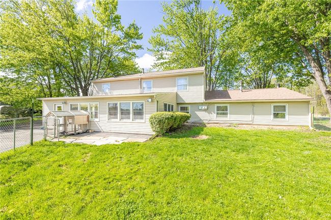 Back yard has small fenced portion for pets | Image 32