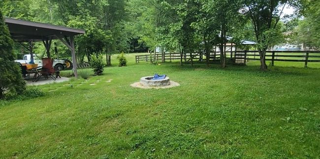 A fire pit is located near the pavilion. | Image 14