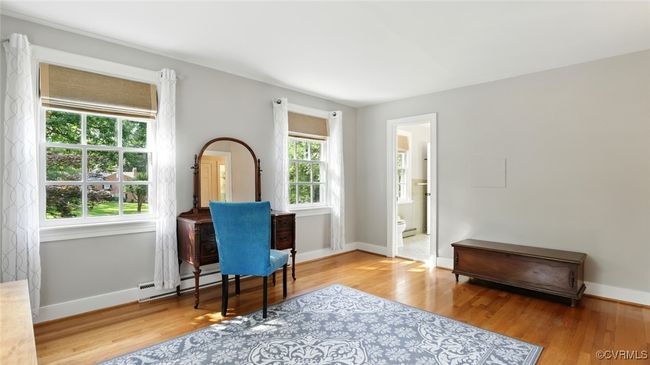 Office with a baseboard radiator and wood finished floors | Image 22