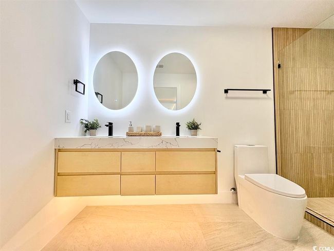 Bathroom featuring vanity and a shower | Image 21