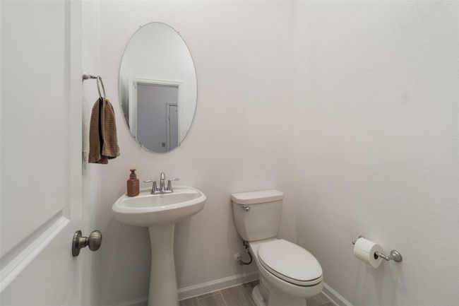 This half bath is great for guests and situated outside of the office area. | Image 12