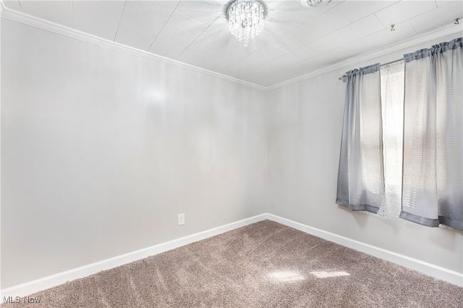 Unfurnished room with baseboards, ornamental molding, and carpet flooring | Image 29