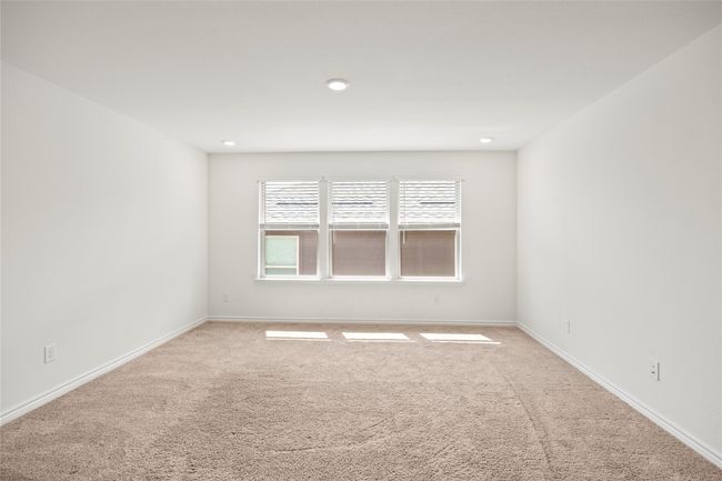Spare room featuring carpet flooring, baseboards, and recessed lighting | Image 34