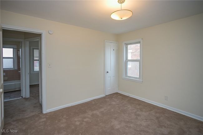 Carpeted spare room featuring baseboards | Image 12