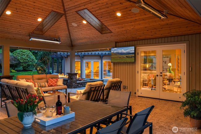 Perfect outdoor living space with cathedral skylighting. Outdoor BBQ living. | Image 16