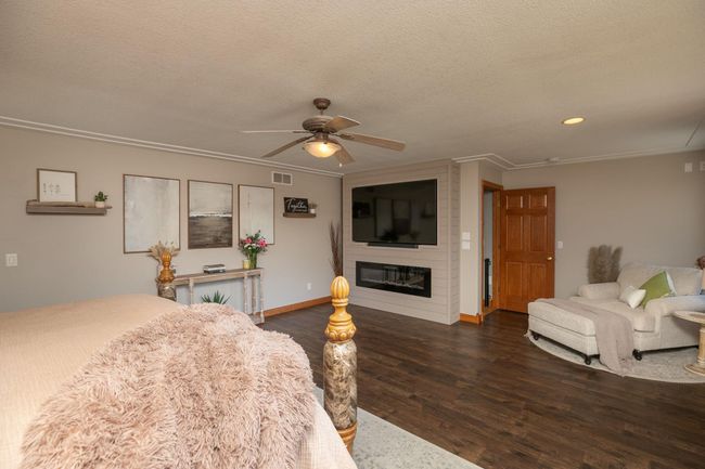 Primary Bedroom with Electric Fireplace | Image 23