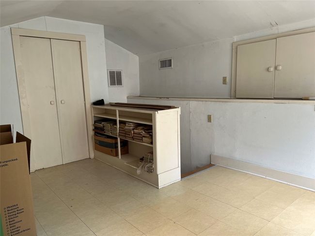 Upstairs 4th bedroom, with built-n book shelves, storage & mattress base. | Image 11
