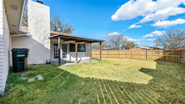 View of yard featuring a patio area and a fenced backyard | Image 28