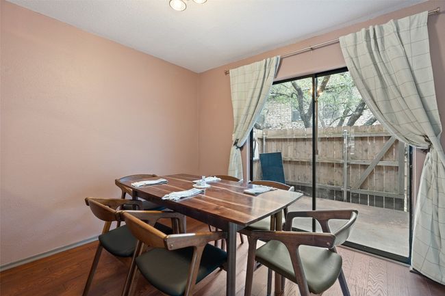 Dining space featuring baseboards and hardwood / wood-style floors | Image 16