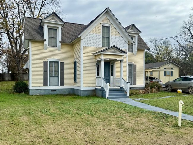 Victorian house featuring a front yard and a shingled roof | Image 5