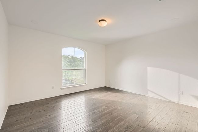 Unfurnished room featuring wood finished floors and baseboards | Image 20