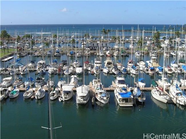 One of the few properties in Waikiki that you have a direct view of the water. Enjoy beautiful unobstructed views of the Waikiki Yacht Harbor, Magic Island, coastline, Wai'anae Mountain Range, and the colorful Hawaiian sunsets. | Image 1