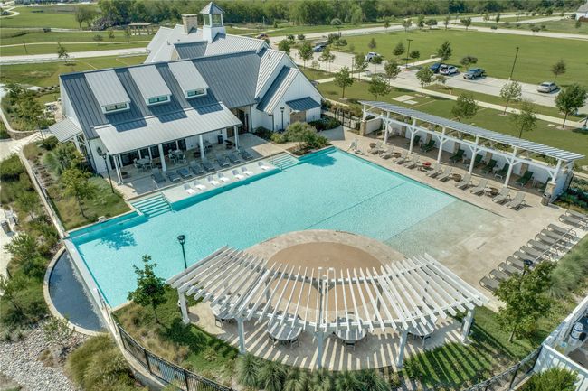 Lounge around the pool with your family and guests for relaxation and entertainment. | Image 34
