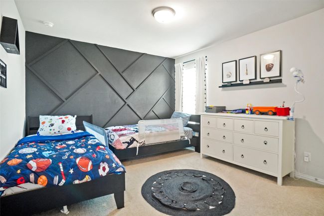 Bedroom with light colored carpet and baseboards | Image 16