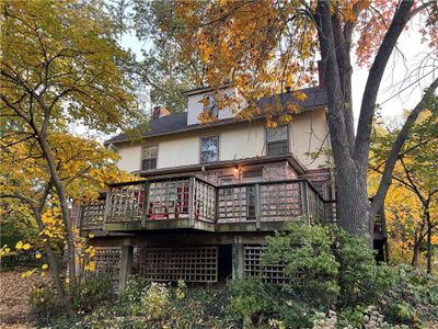 Back of house with a wooden deck | Image 3