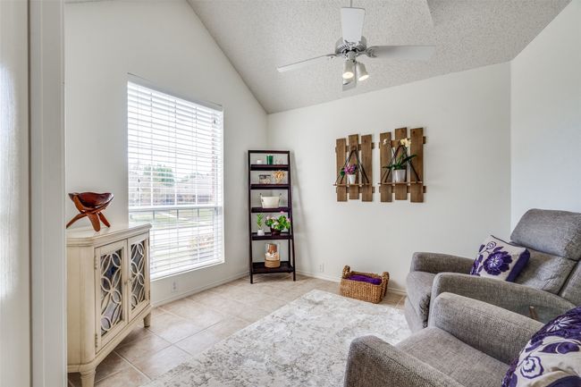 Just off the entry hall is a flexible space offering a perfect private office, second living space or playroom. | Image 14
