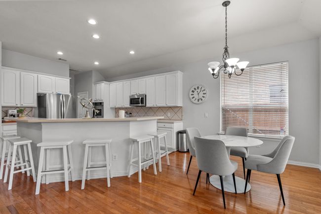 Dining room with recessed lighting, a chandelier, visible vents, and light wood-type flooring | Image 25