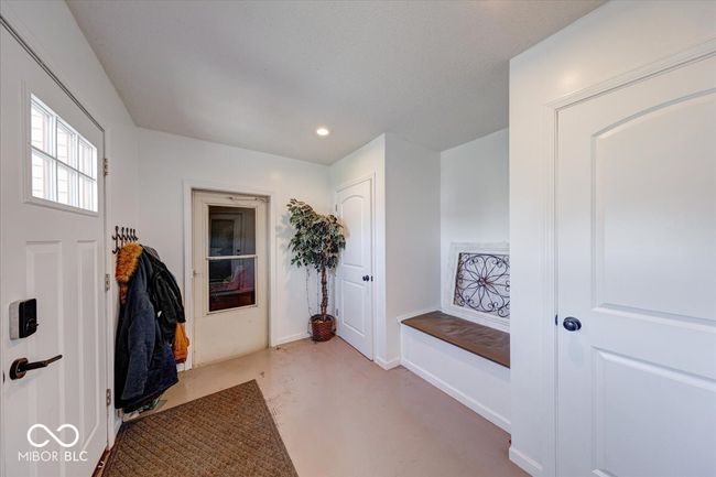 secondary entrance that leads to either the garage or into the main house | Image 11