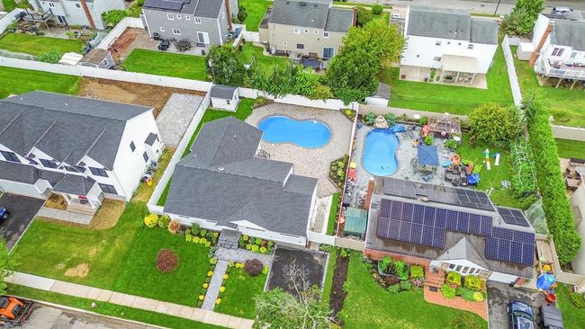 Aerial view of residential area featuring a pool area | Image 35