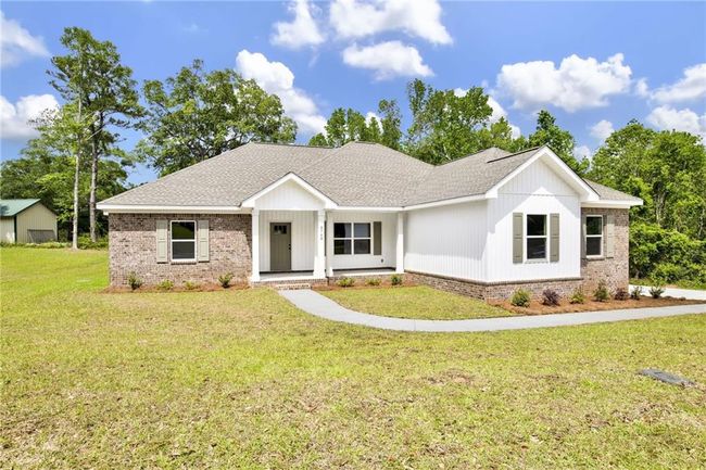 View of front of property with a porch, brick siding, a front yard, and roof with shingles | Image 6