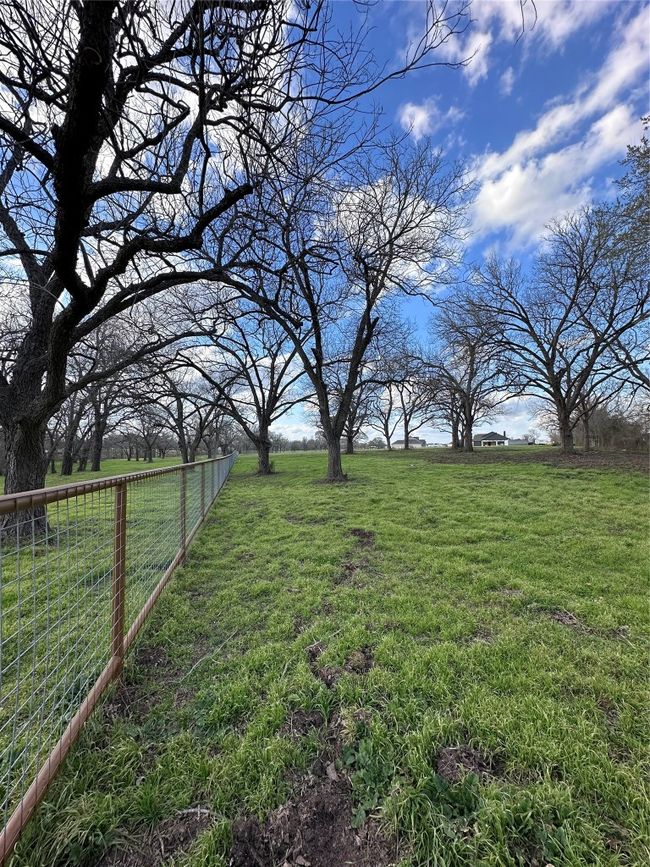 View of yard featuring a rural view and fence | Image 14