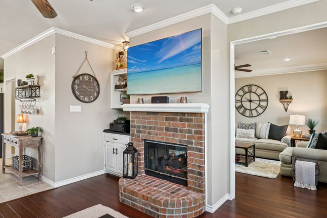 Family room side with built in cabinet and shelves. | Image 11