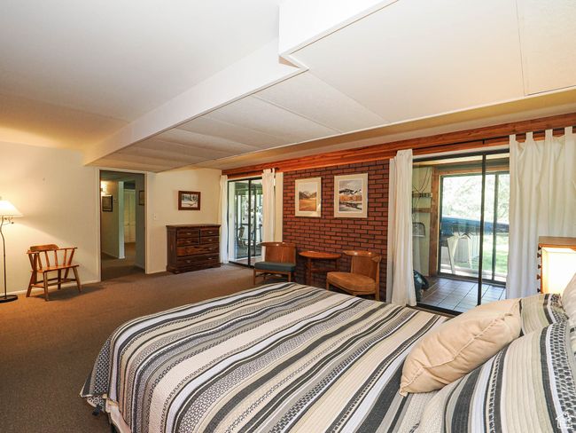 Bedroom with access to outside, multiple windows, and carpet floors | Image 48