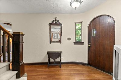 Foyer entrance with a textured ceiling and hardwood / wood-style floors | Image 3