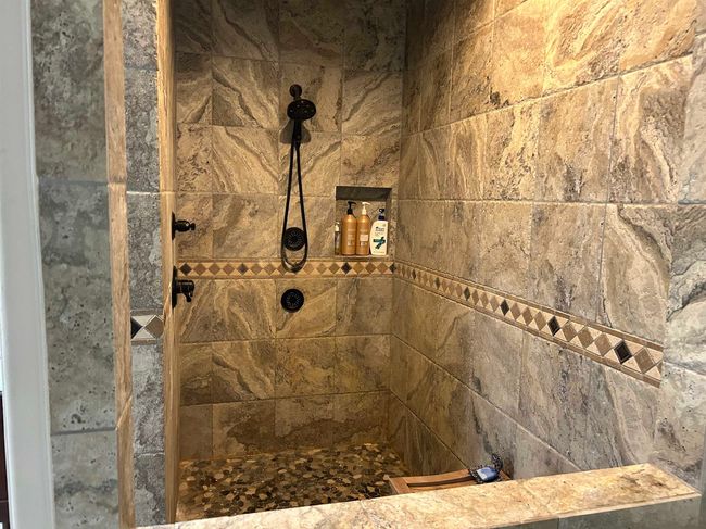 Bathroom featuring tiled shower | Image 23