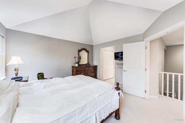 Bedroom with lofted ceiling, light colored carpet, and a closet | Image 15