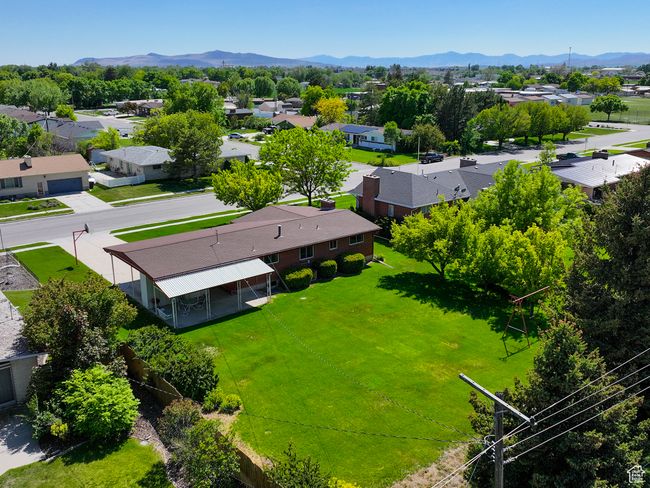 Aerial perspective of suburban area with a mountainous background | Image 5