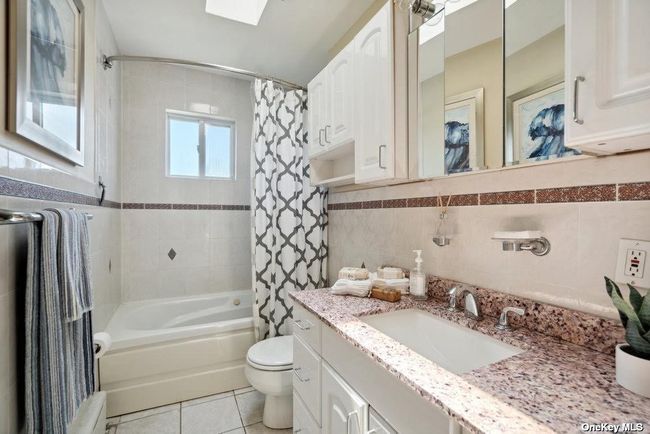 Spacious Full Tiled Bath w/Jetted Tub, Fancy Stone Vanity, Great Storage, WaterView and Skylight! | Image 18