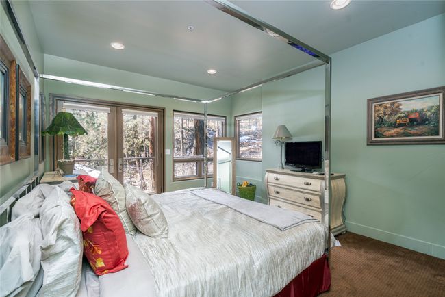 Bedroom with dark colored carpet, french doors, and access to outside | Image 26