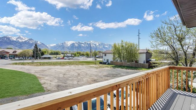 Wooden terrace featuring a mountain view | Image 11