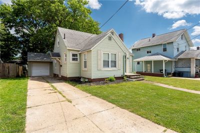 View of front of house with a garage and a front yard | Image 2