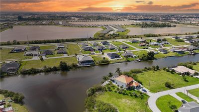 Aerial view at dusk featuring a water view | Image 2