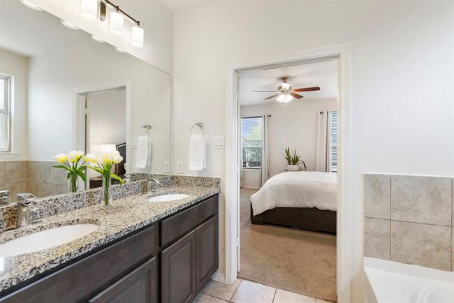 Another view of the primary bathroom looking into the primary suite. | Image 24