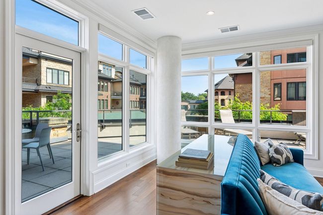Easily access the corner wrap-around deck from the living spaces. | Image 12