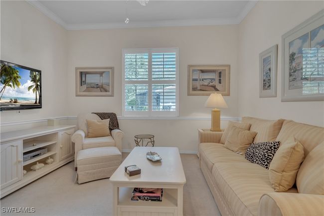 Living area with light colored carpet and ornamental molding | Image 9