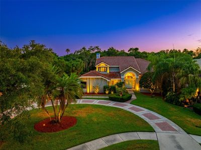 Grand entrance through manicured front lawn | Image 1