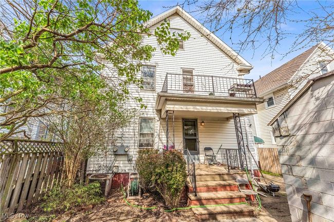 View of front of home featuring fence, a porch, and a balcony | Image 25
