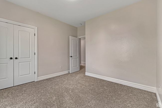Unfurnished bedroom featuring carpet and a closet | Image 27